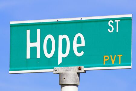 The sign direction on a blue isolated backgroundの写真素材