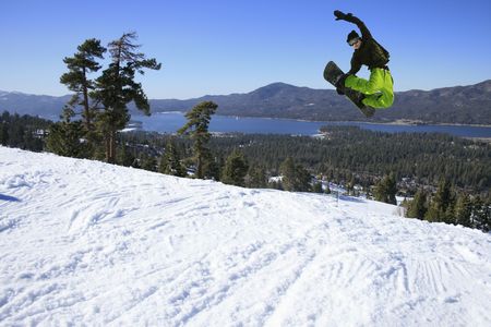 Snowboarder jumping high in the airの写真素材