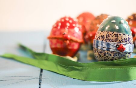 Colorful Easter eggs on a white background, orange, blue, redの写真素材
