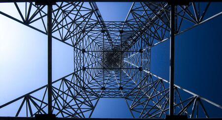 High technology background. Power transmission pylon, bottom view. Square, geometric shapes.の写真素材