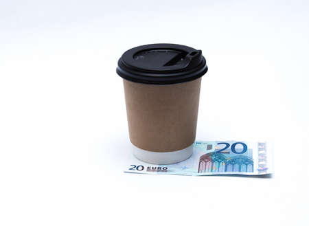 A cup of coffee and moneyの写真素材