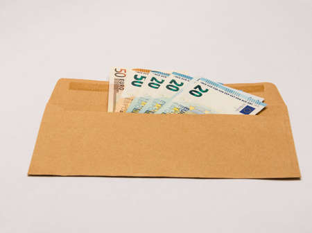 Euro banknotes in a paper envelopeの写真素材