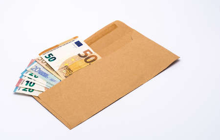Several euro banknotes in a paper envelopeの写真素材