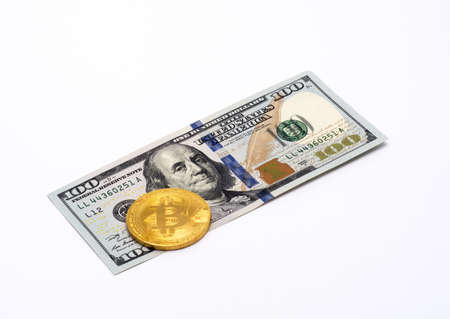 Ten dollar denomination and one bitcoinの写真素材