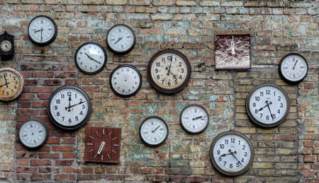 a lot of old hours on a dilapidated wall of red brickのeditorial素材