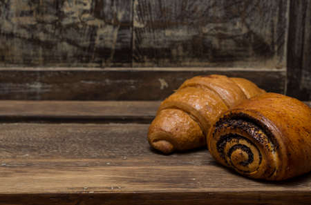 homemade pastries on an old oak boardの写真素材