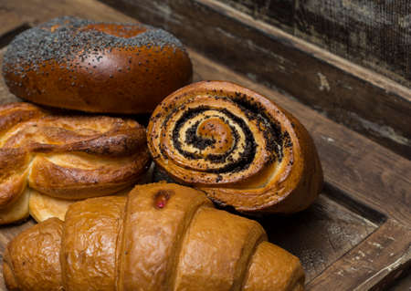 homemade pastries on an old oak boardの写真素材