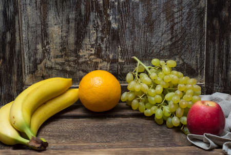 fresh fruit on an oak tableの写真素材