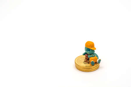 a toy dragon builder resting and sleeping on a pile of golden bitcoins - success!