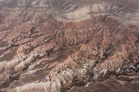 view from the top on the red valley in Cappadocia (GÃ¶reme village) from the balloon basketの写真素材