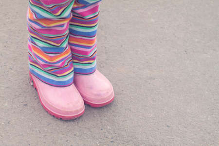 Pink boots, striped pantsの写真素材