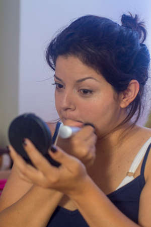 Woman getting makeupの写真素材