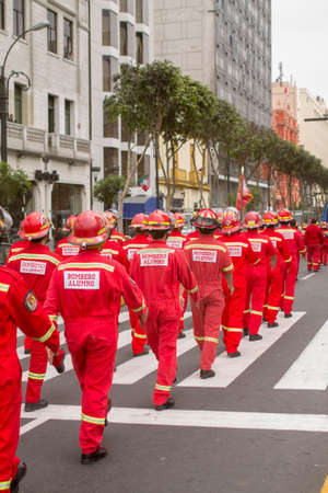 LIMA, PERU - AUG 29TH 2015: Parade of the firefighters of the city of Lima for reasons of patriotic dates of Peru.のeditorial素材