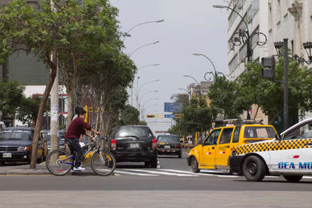 LIMA, PERU - AUG 29TH 2015: The chaos of traffic in the city of Lima, affecting cyclists, pedestrians and vehicles. Lima Peruのeditorial素材