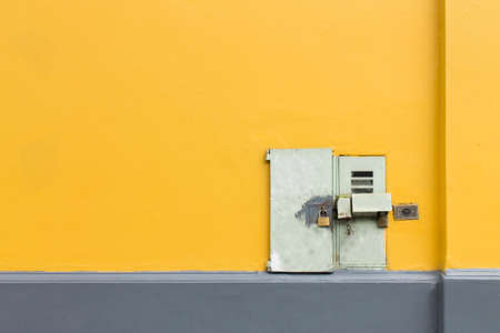Set of lines on the wall with padlocked doorの写真素材