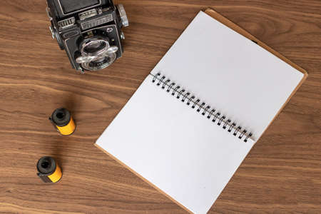 Taking notes of photography on the deskの写真素材