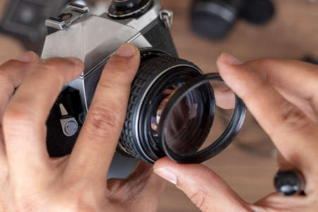 Placing a filter photographic cameraの写真素材