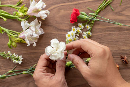 Holding flowers with handsの写真素材