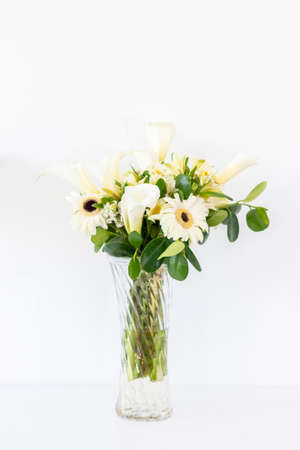 Floral arrangement of callas lilly and gerberasの写真素材