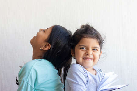 Two little girls looking at each otherの写真素材