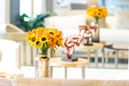 Floral arrangement  of sunflowers decorating the living room of the houseの写真素材