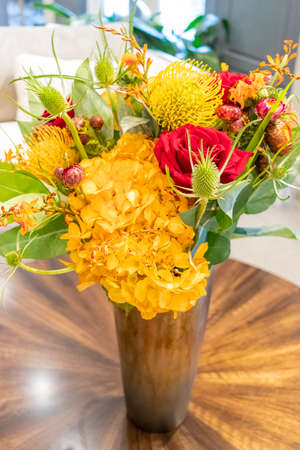 Floral arrangement of roses and carnations decorating the living room of the houseの写真素材