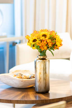 Floral arrangement  of sunflowers decorating the living room of the houseの写真素材
