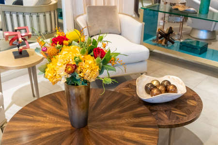 Floral arrangement of roses and carnations decorating the living room of the houseの写真素材