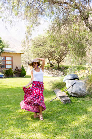 Pretty woman dancing flamenco in the garden of the houseの写真素材