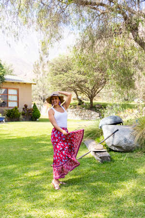 Pretty woman dancing flamenco in the garden of the houseの写真素材