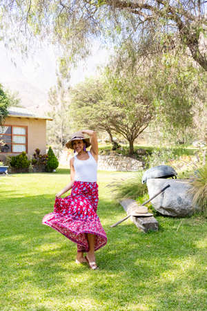 Pretty woman dancing flamenco in the garden of the houseの写真素材
