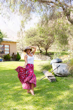 Pretty woman dancing flamenco in the garden of the houseの写真素材