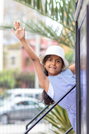 Smiling brunette girl with striped dressの写真素材