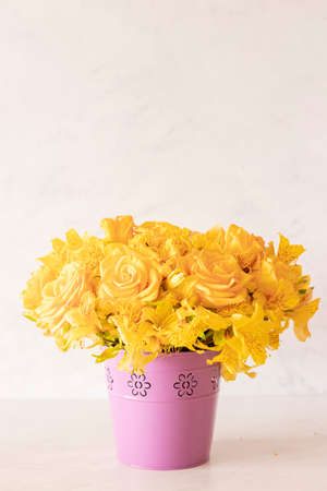 Floral arrangement composed of yellow roses for springの写真素材