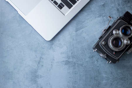 Photography work environment with laptop and cameraの写真素材