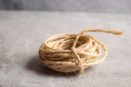 View of a roll of rope on a golden backgroundの写真素材