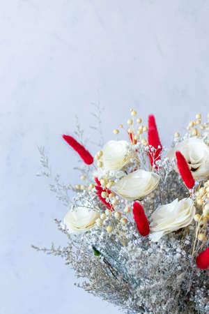Bouquet of colorful dried flowers and white rosesの写真素材