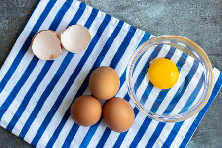View of raw eggs, with their shellsの写真素材