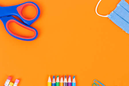 Back to school background with supplies and face mask, copy space.の写真素材