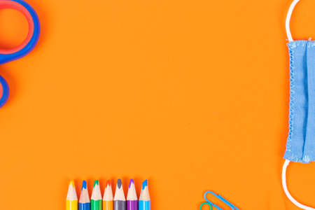Back to school background with supplies and face mask, copy space.の写真素材