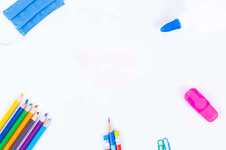 Back to school background with supplies and face mask, copy space.の写真素材
