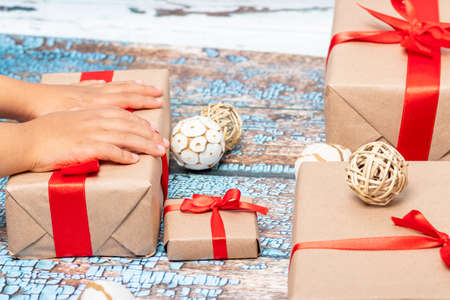 Little girl opening presents on Christmas dayの写真素材