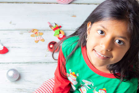Little girl opening presents on Christmas dayの写真素材