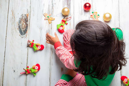 Little girl opening presents on Christmas dayの写真素材