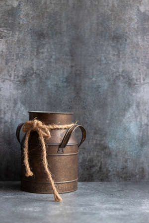 Worn aluminum container on gray background with copy spaceの写真素材