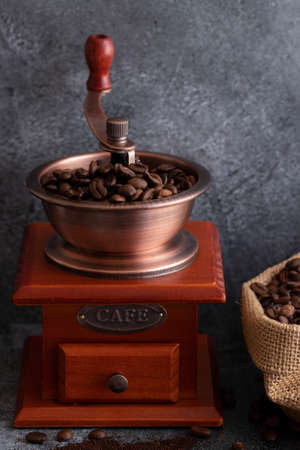 Coffee beans and a wooden grinderの写真素材