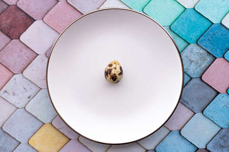 Quail eggs inside a decorative plate and on a backgroundの写真素材