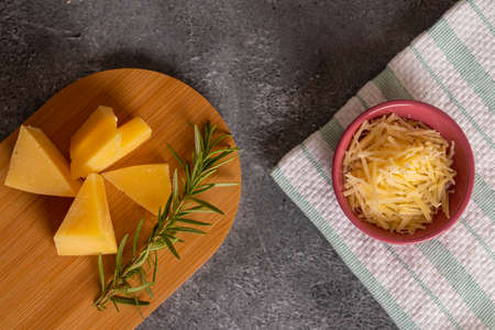 Tray with pieces of Parmesan cheese and fine herbsの写真素材