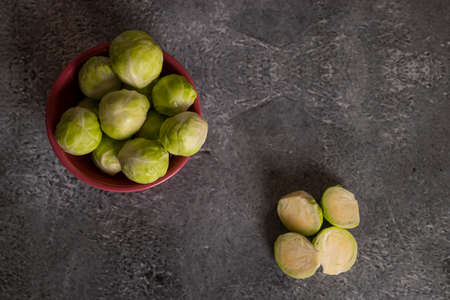 Fresh brussels sprouts served in bowl and with marbled gray backgroundの写真素材