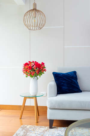 Flower arrangement of red roses in a nice living roomの写真素材